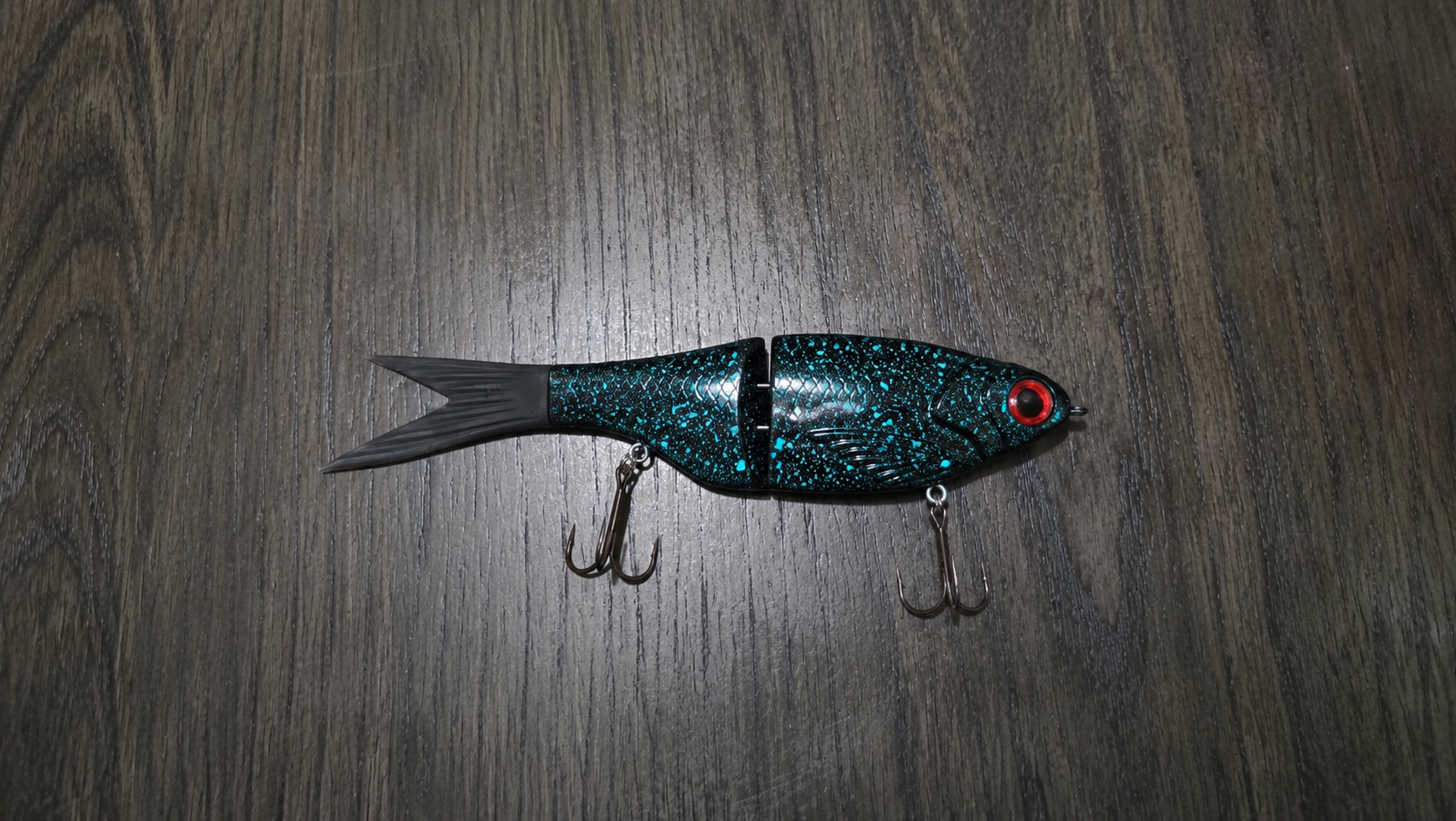 8.5 teal splatter glide bait